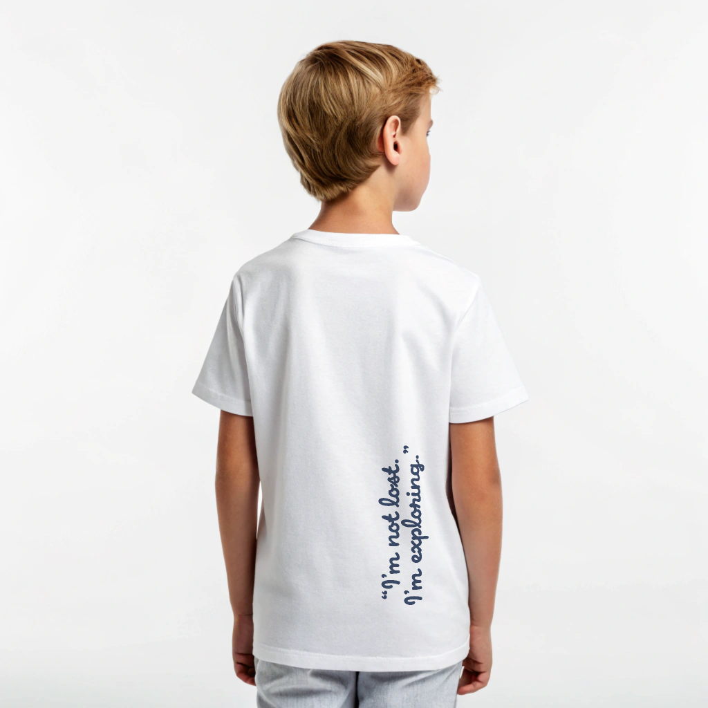 Kids Ray Tee in white cotton, Ray mascot screenprinted on chest, ‘I’m not lost, I’m exploring’ text on back, screenprinted in Arosa, Switzerland.