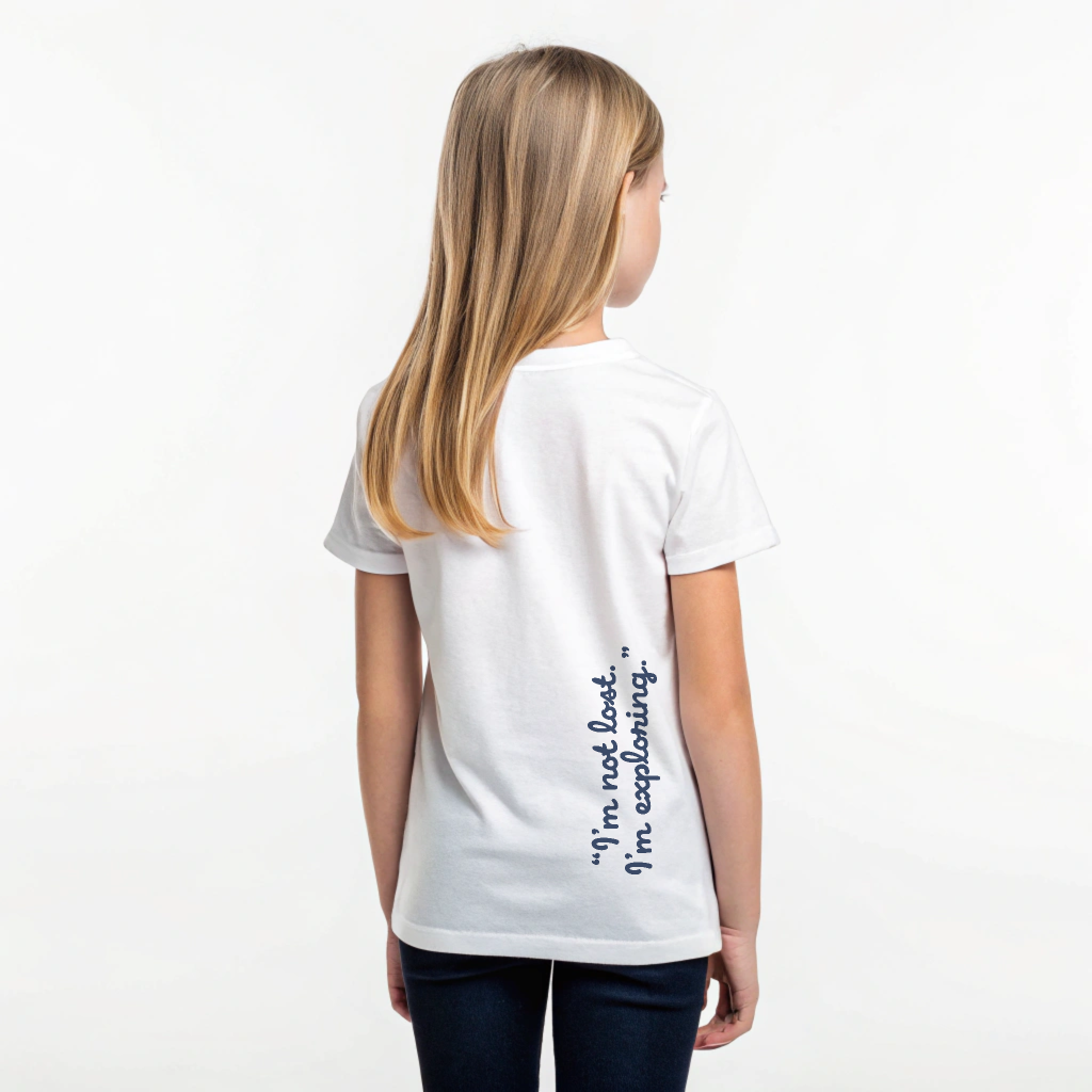 Kids Ray Tee in white cotton, Ray mascot screenprinted on chest, ‘I’m not lost, I’m exploring’ text on back, screenprinted in Arosa, Switzerland.